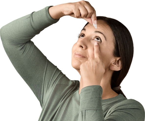 Actor portrayal of woman applying YUVEZZI eye drops for presbyopia 